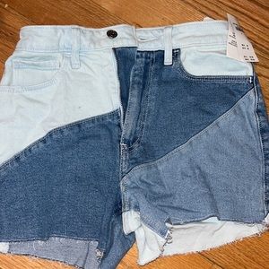 hollister jean shorts that have different shades of blue on them